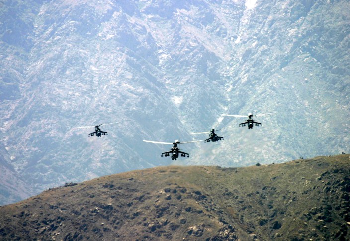 Attack helicopters flying over mountains, Kabul