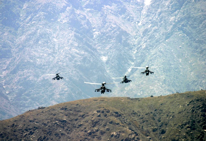 Attack helicopters flying over mountains, Kabul
