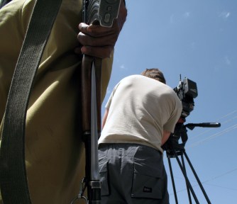 Western cameraman operating under watchful eye of the authorities, Quetta, Baluchistan Province, Pakistan